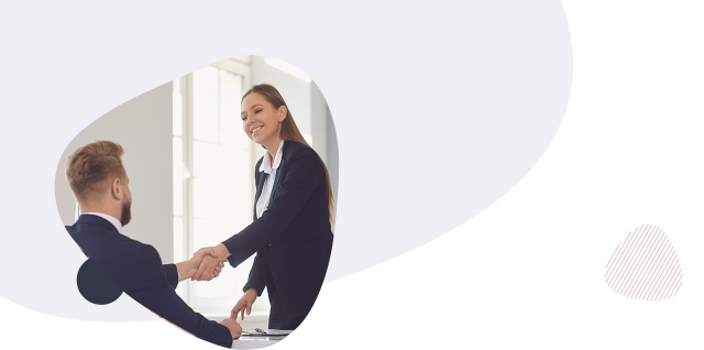 Man and woman in business attire shaking hands