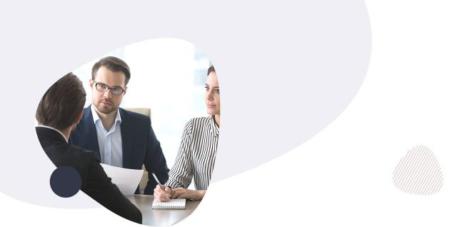 professionals interviewing a man